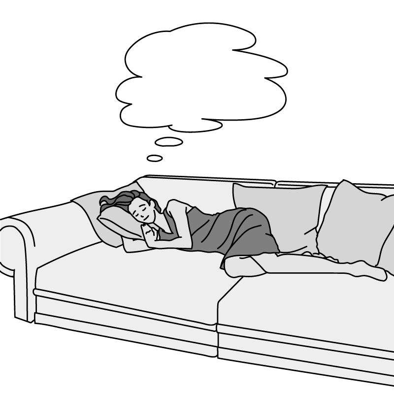 ソファーでうたた寝をする女性（モノクロ）